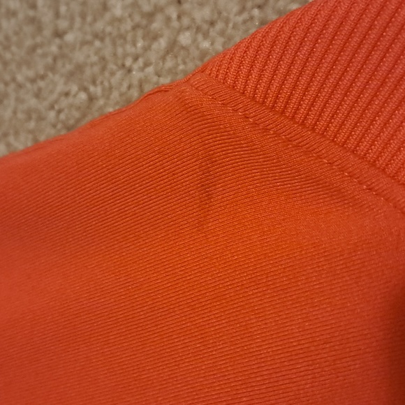 This is a Nike youth sweatshirt, size 6-7. Color: Orange - Picture 3 of 4